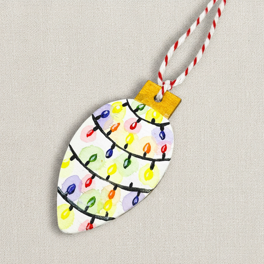 Decorative Christmas ornament shaped like a tree light with colourful hand painted lights on a white background