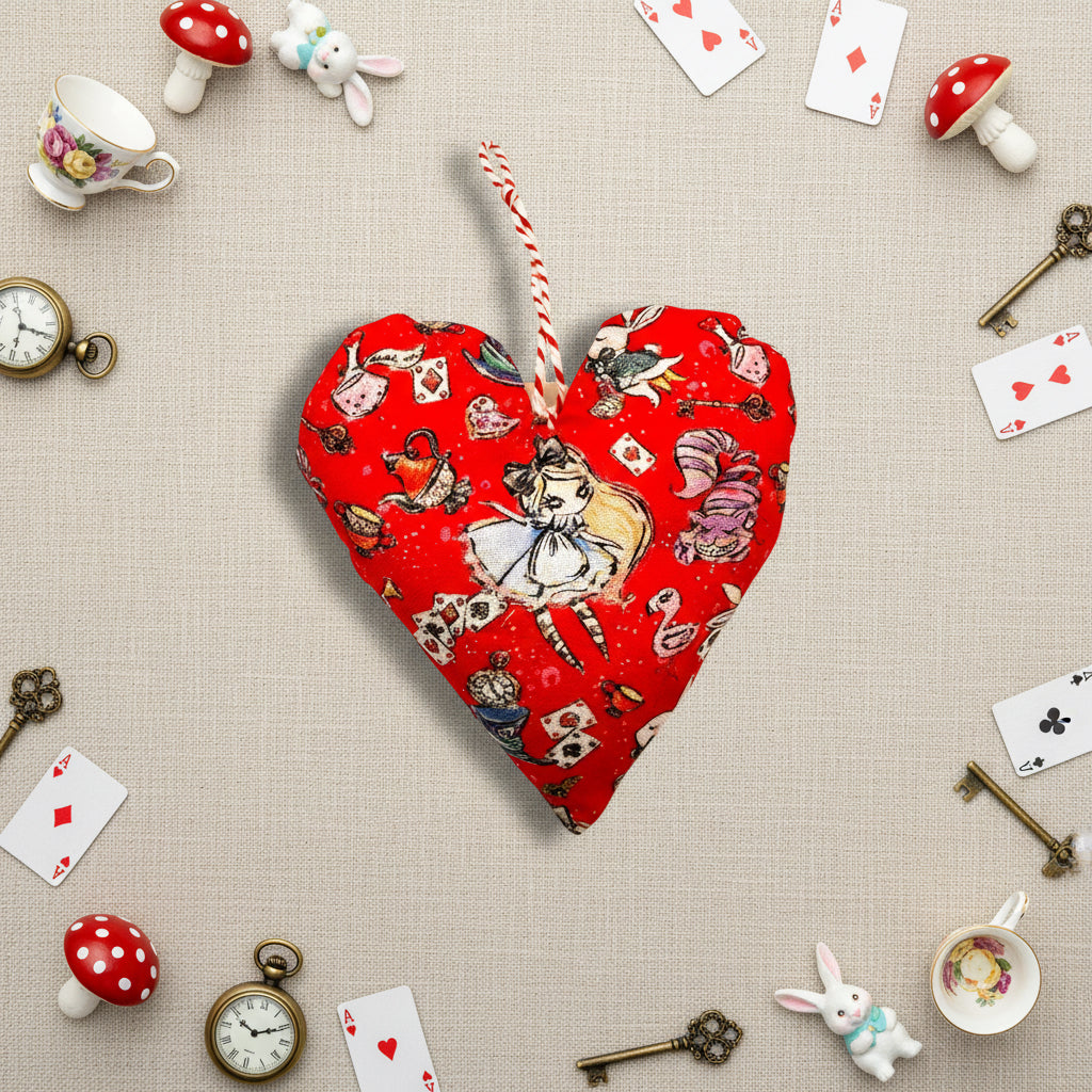 Heart-shaped red fabric ornament with Alice in Wonderland design