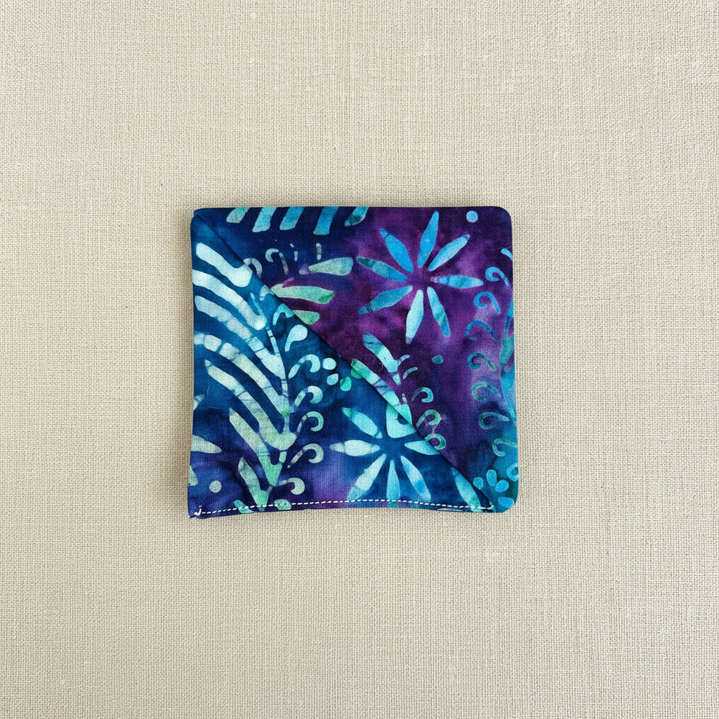 Blue and purple patterned fabric corner bookmark, square shaped