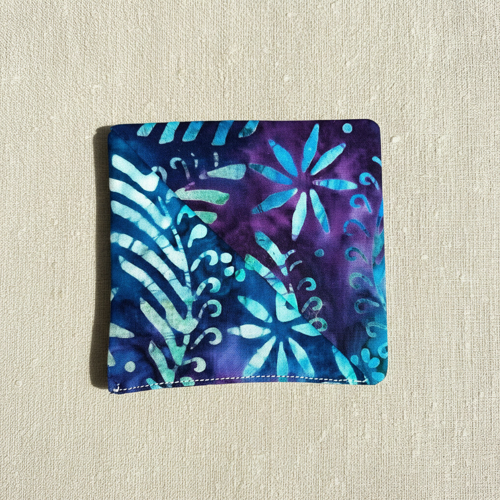 Floral patterned fabric corner bookmark with blue and purple colours , square shaped 