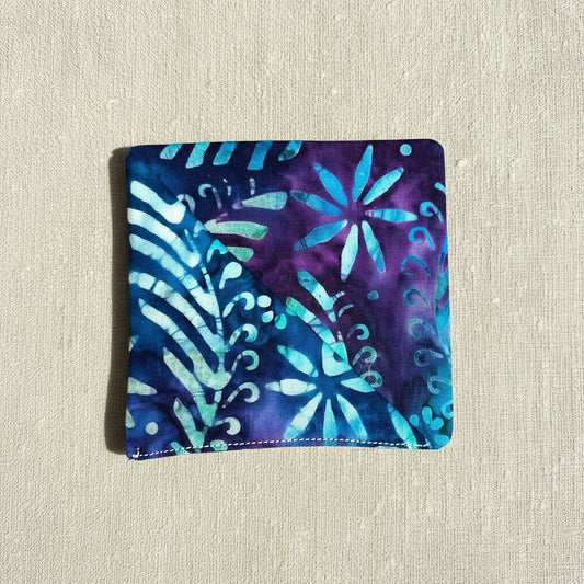 Floral patterned fabric corner bookmark with blue and purple colours , square shaped 