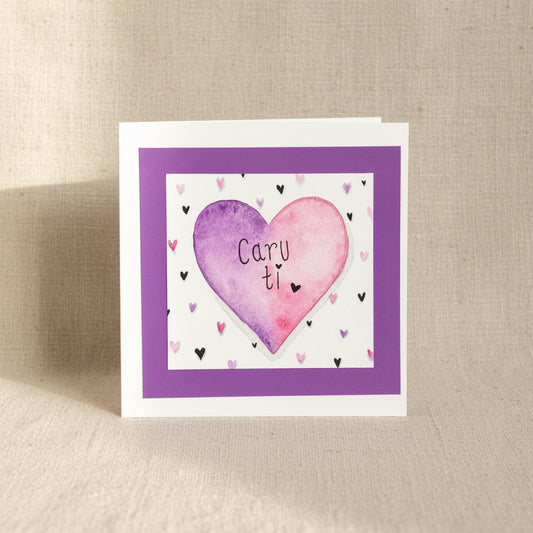Card with a purple and pink heart design and 'Caru ti' text (love you in Welsh).