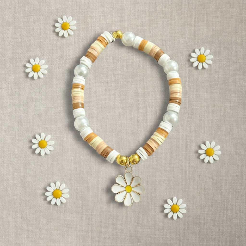 Natural colour flat beads bracelet with metal daisy charm, on linen background 