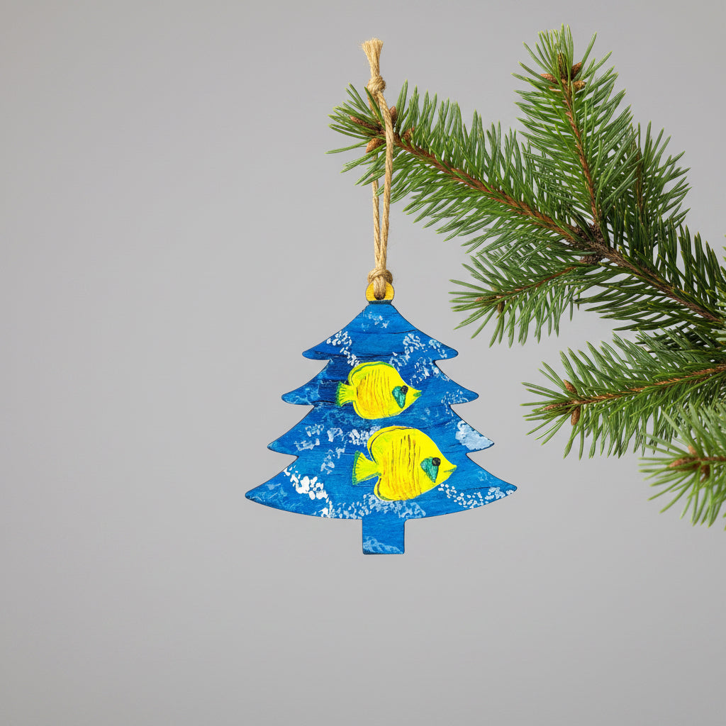 Decorative wooden ornament shaped like a blue Christmas tree with yellow fish