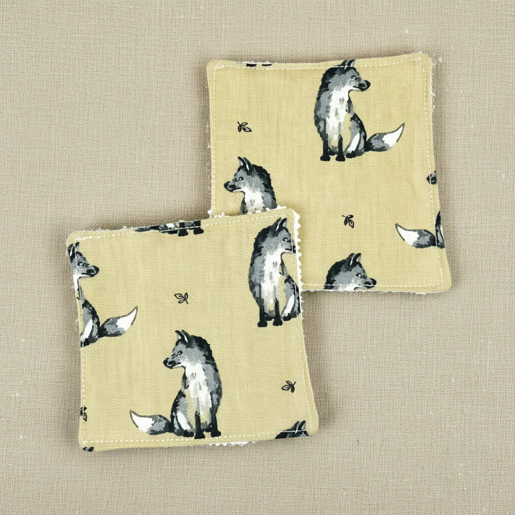 Two square fox themed reusable face wipes showing fox side (fabric)