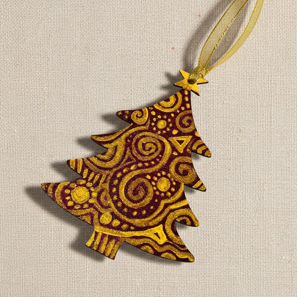 Decorative wooden Christmas tree shaped ornament with gold patterns on a dark red background