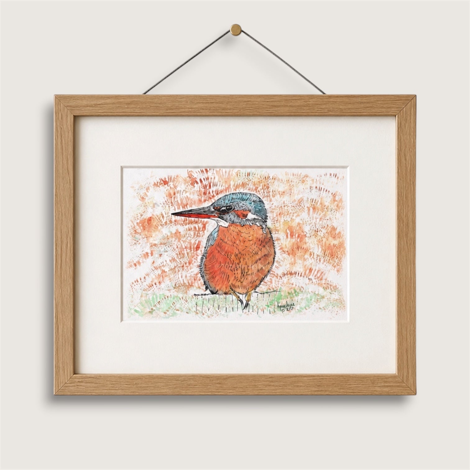 Framed artwork of a British kingfisher bird on a white wall