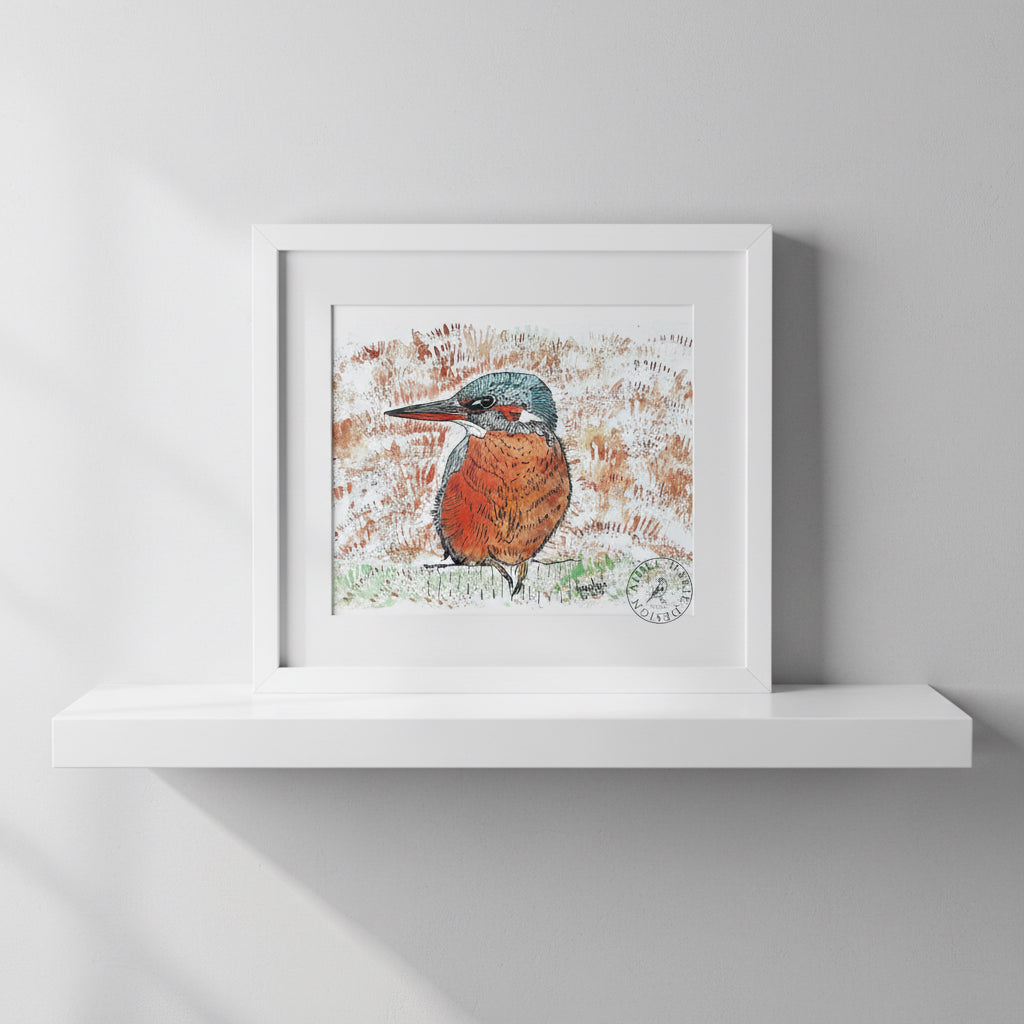 Kingfisher print in frame on a shelf