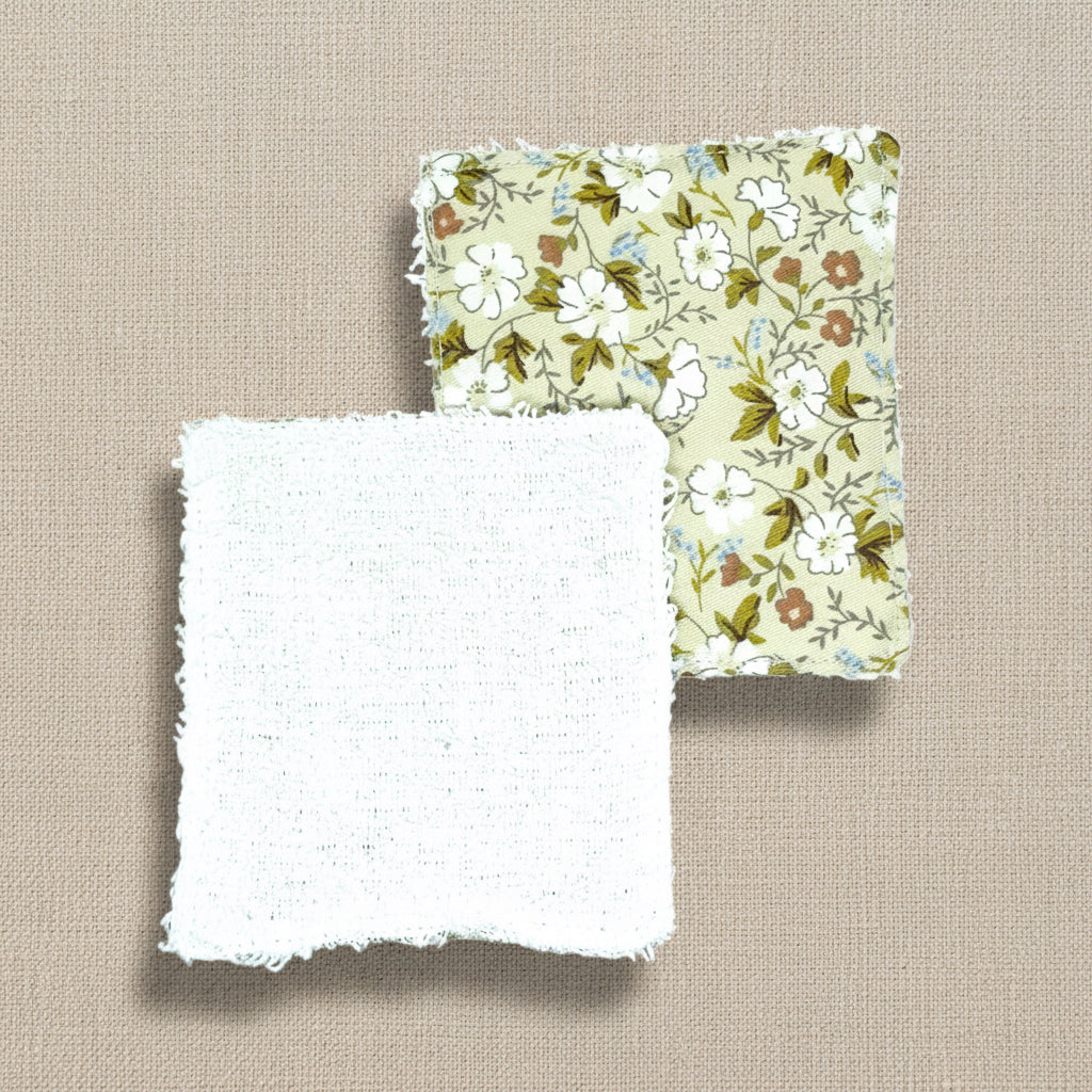 Floral-patterned fabric square shaped reusable face wipes one showing front and one showing back