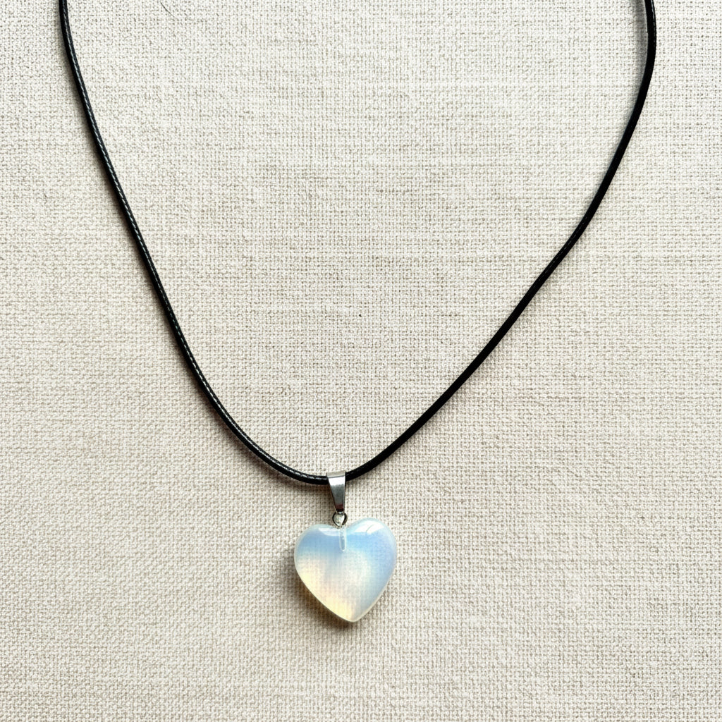 Necklace with a heart-shaped pendant on a black cord