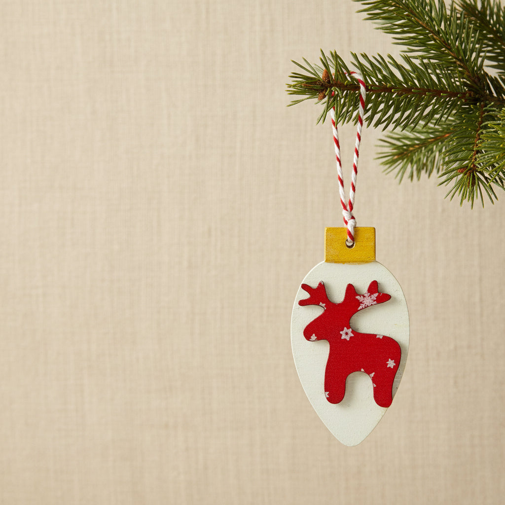 Decorative Christmas ornament with red reindeer design on a white background