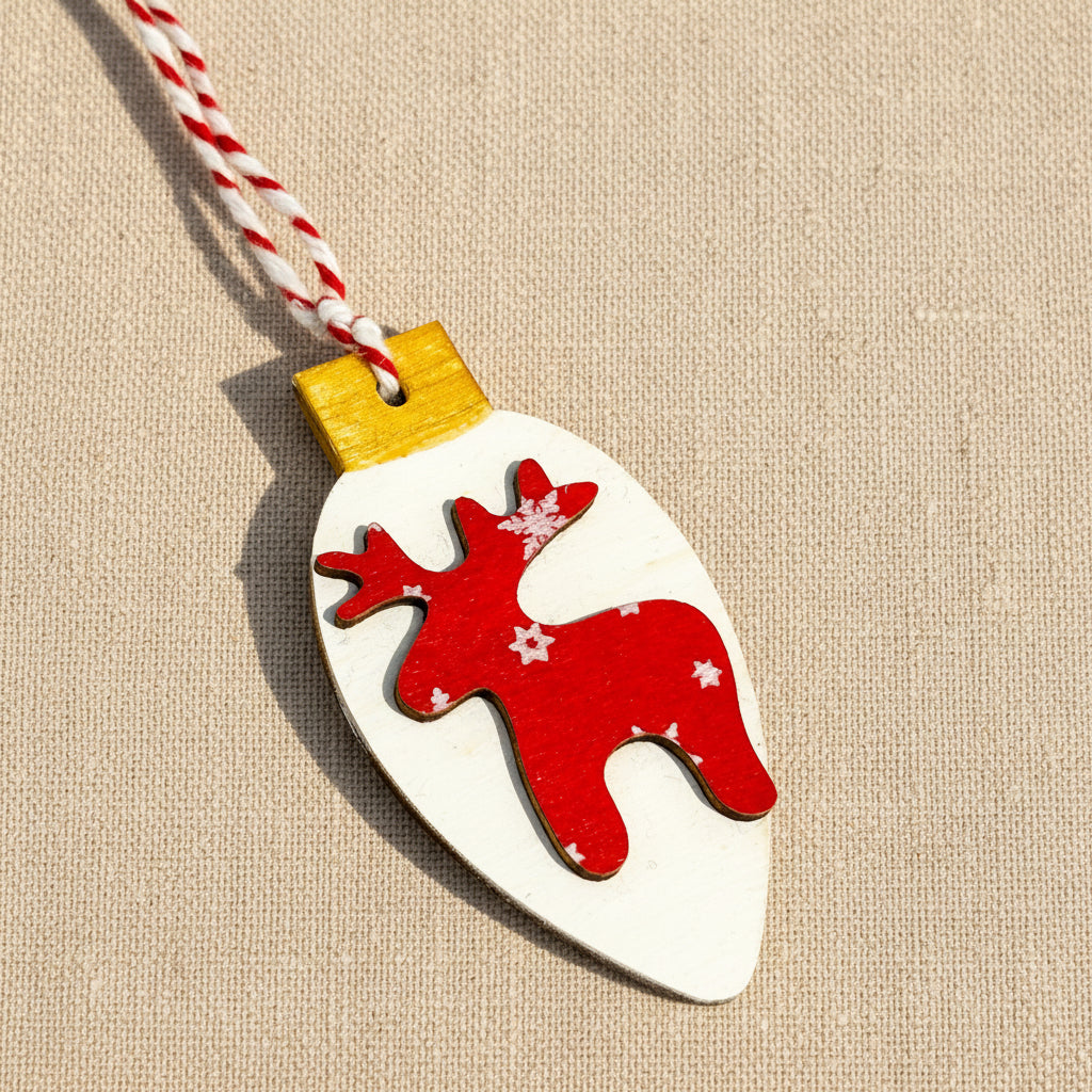 Decorative Christmas ornament with a red reindeer design on a white background