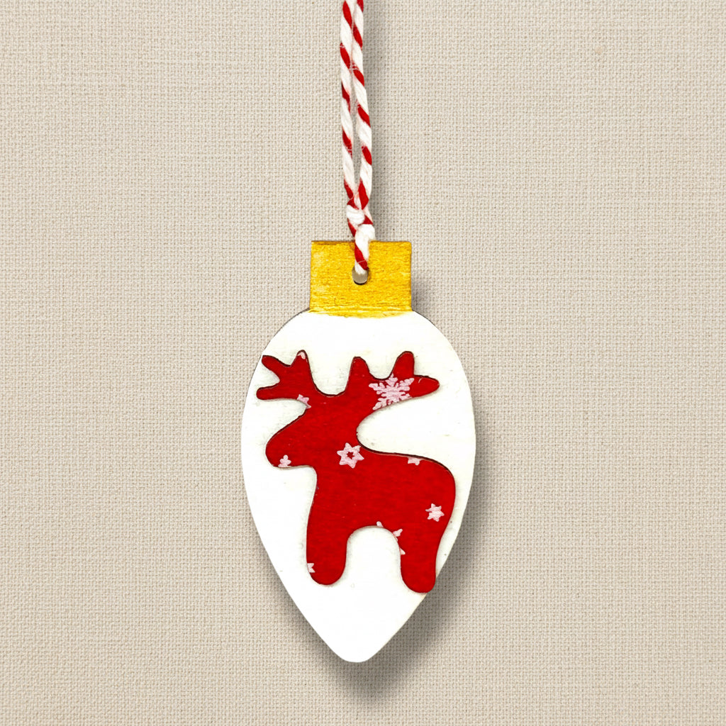Decorative reindeer ornament on a white background