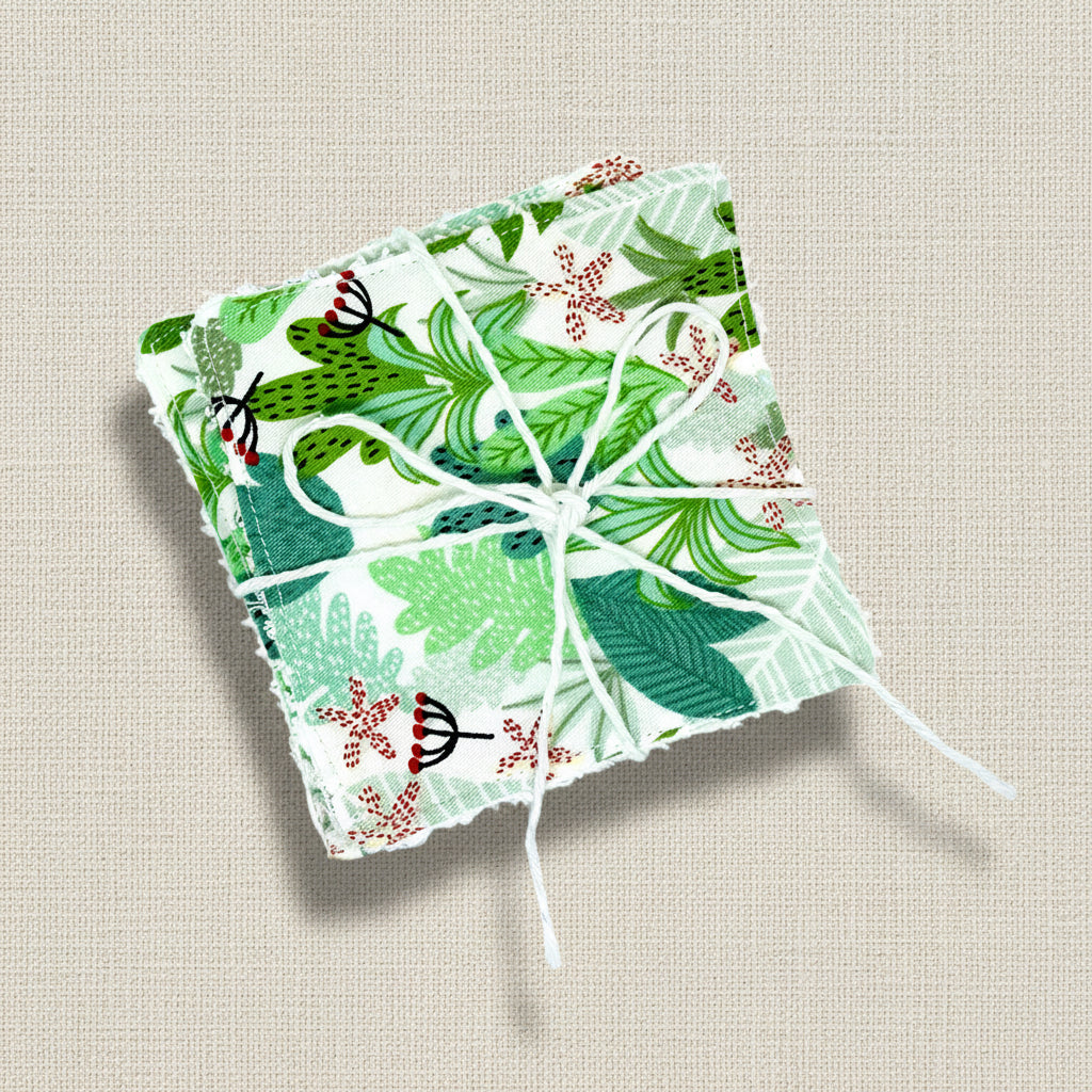 Pack of two botanical themed reusable face wipes held together by some natural twine