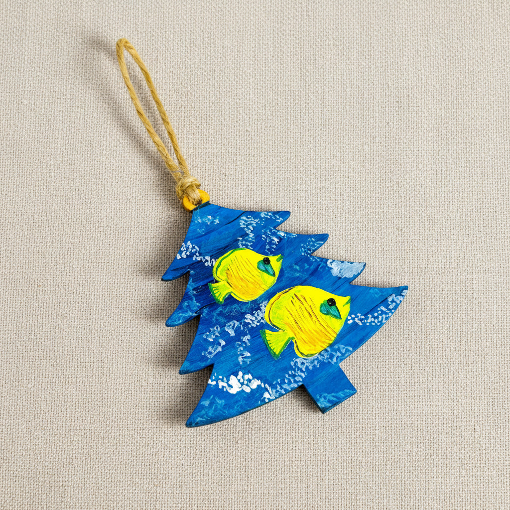 Decorative wooden ornament shaped like a Christmas tree with blue and white pattern and yellow fish