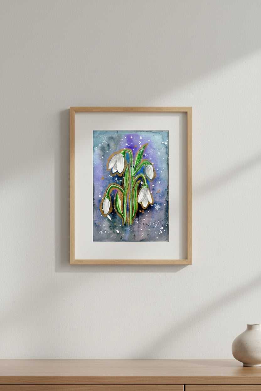 Artistic depiction of snowdrop flowers on a watercolour background, shown in a frame hung on a wall 
