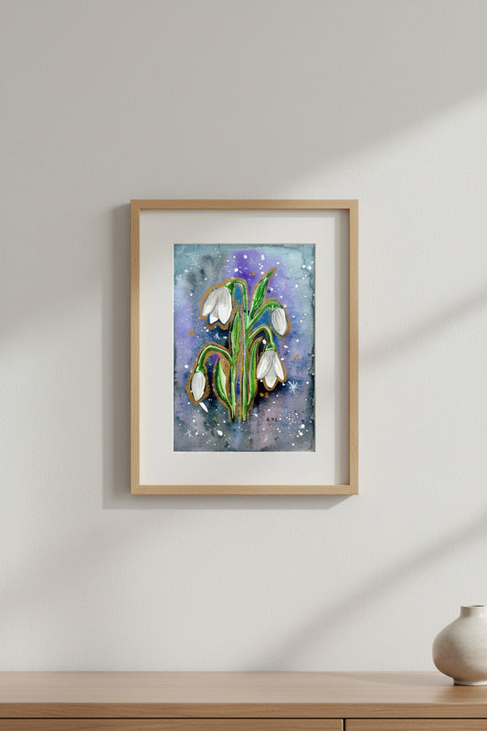 Artistic depiction of snowdrop flowers on a watercolour background, shown in a frame hung on a wall 