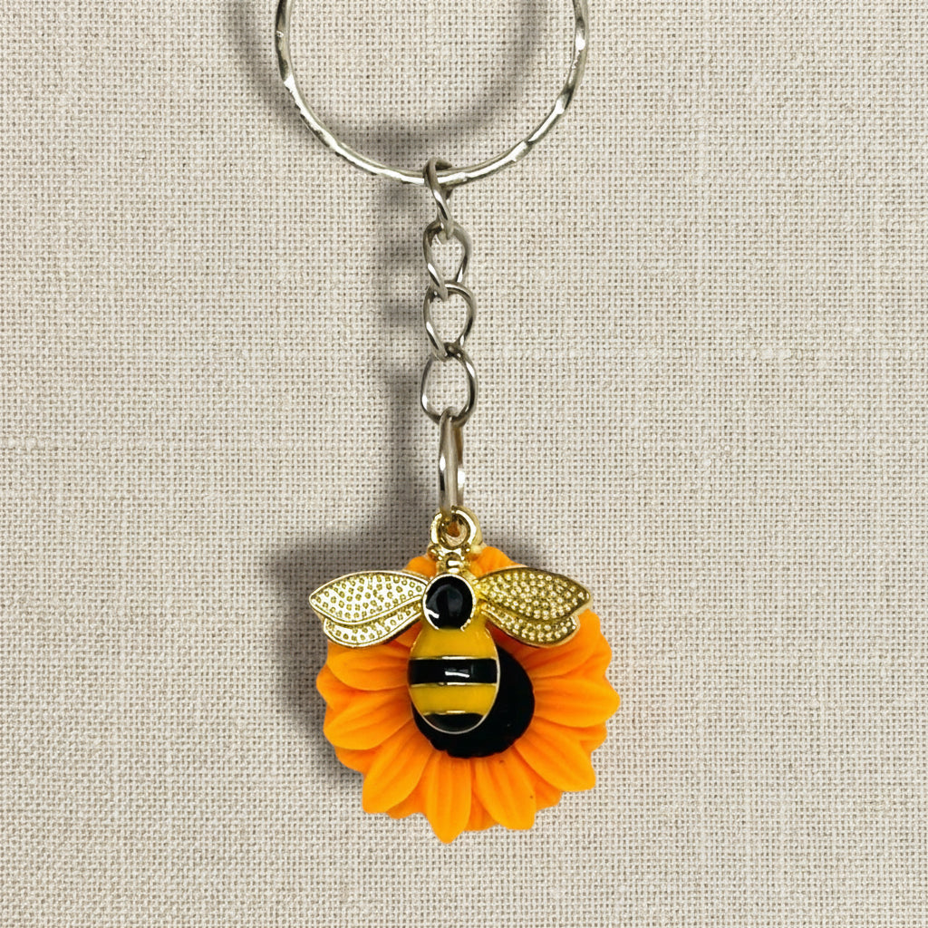 Keychain with bee and sunflower design