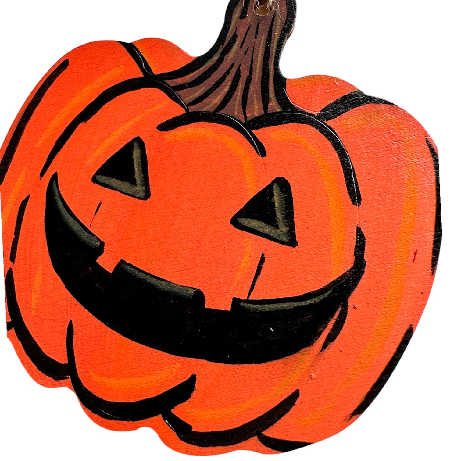 Wooden pumpkin decoration with a carved style painted face