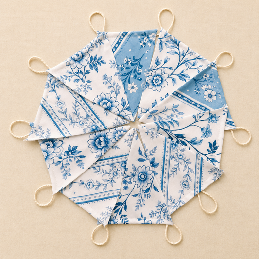 Handmade blue and white floral fabric bunting with 10 patterned flags and natural cotton twine