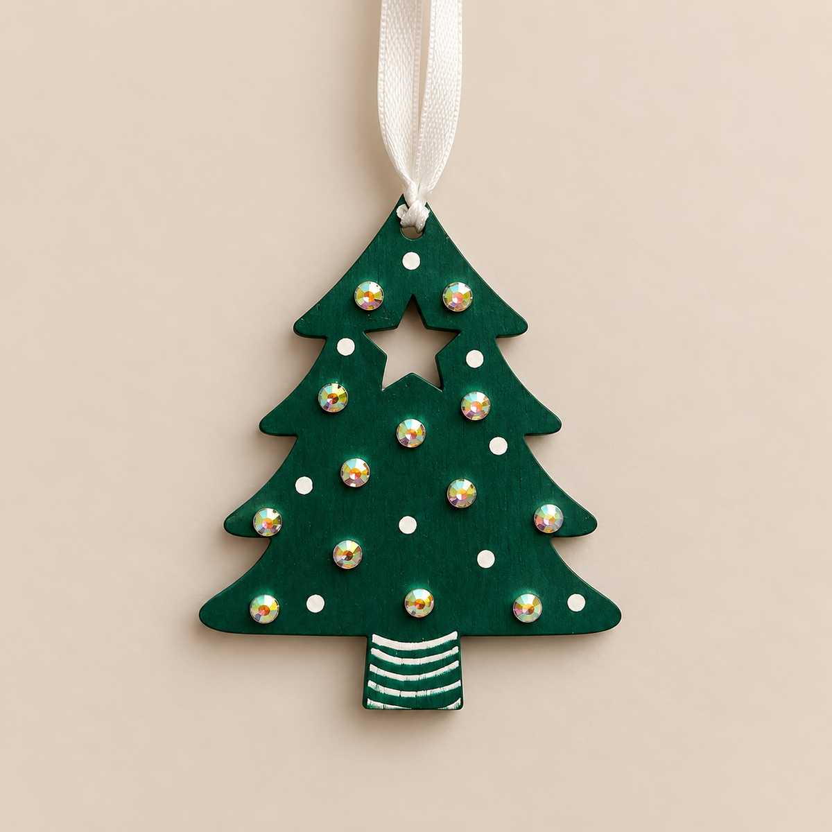 Hand painted green wooden Christmas tree decoration with iridescent gem embellishments and a white ribbon.