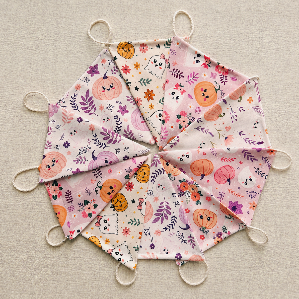 Handmade pastel Halloween fabric bunting with ghost, pumpkin and floral patterns